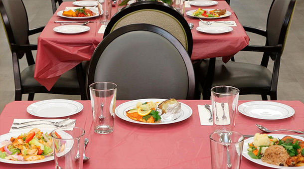 Dining tables with plated food at one of the Four Seasons Adult Day Health Care Centers.