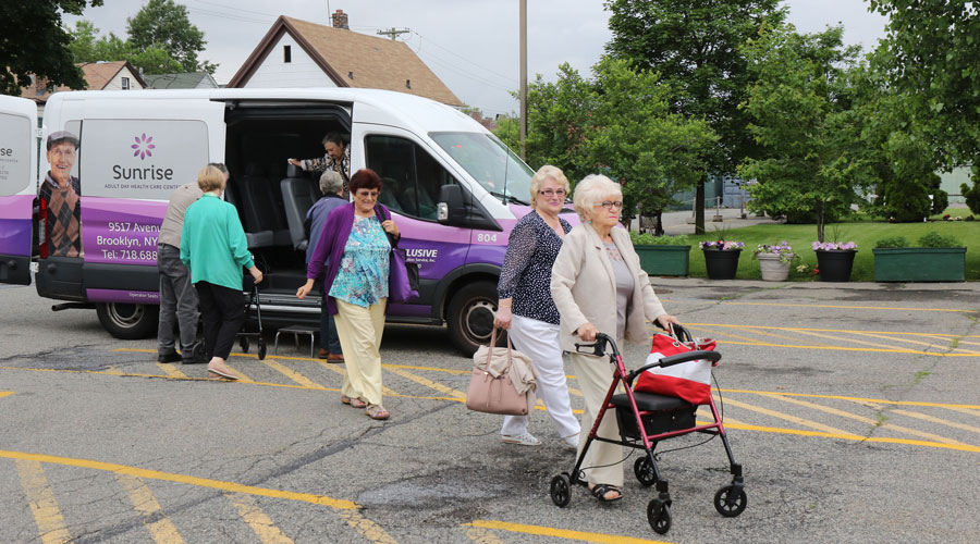 Members of Four Seasons Adult Day Care Center using the center's van to go to medical appointments.