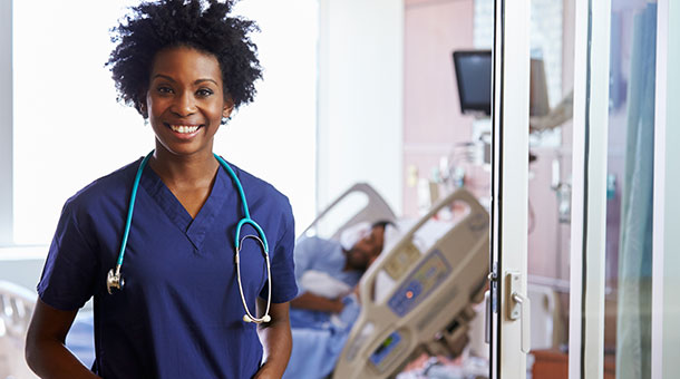 Smiling nurse in a healthcare setting.
