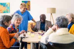 Groups of older adults socialize while at adult day health care