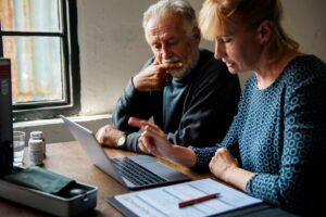 An older man and woman review their advance care plan documents.