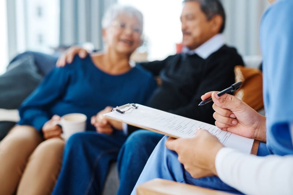 An older woman and man plan for long-term care.